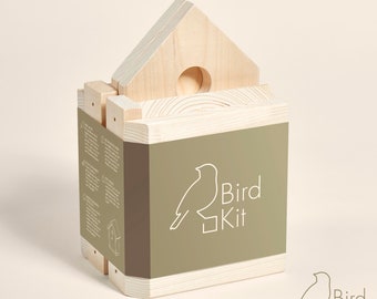 May include: A wooden birdhouse kit with instructions. The kit is packaged in a box with a green label that says "Bird Kit" and features a stylized bird illustration.