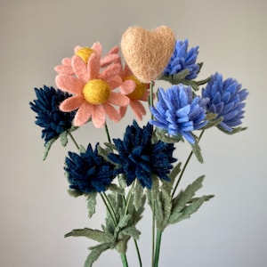 An example of a tiny cameo heart with other small felt flowers