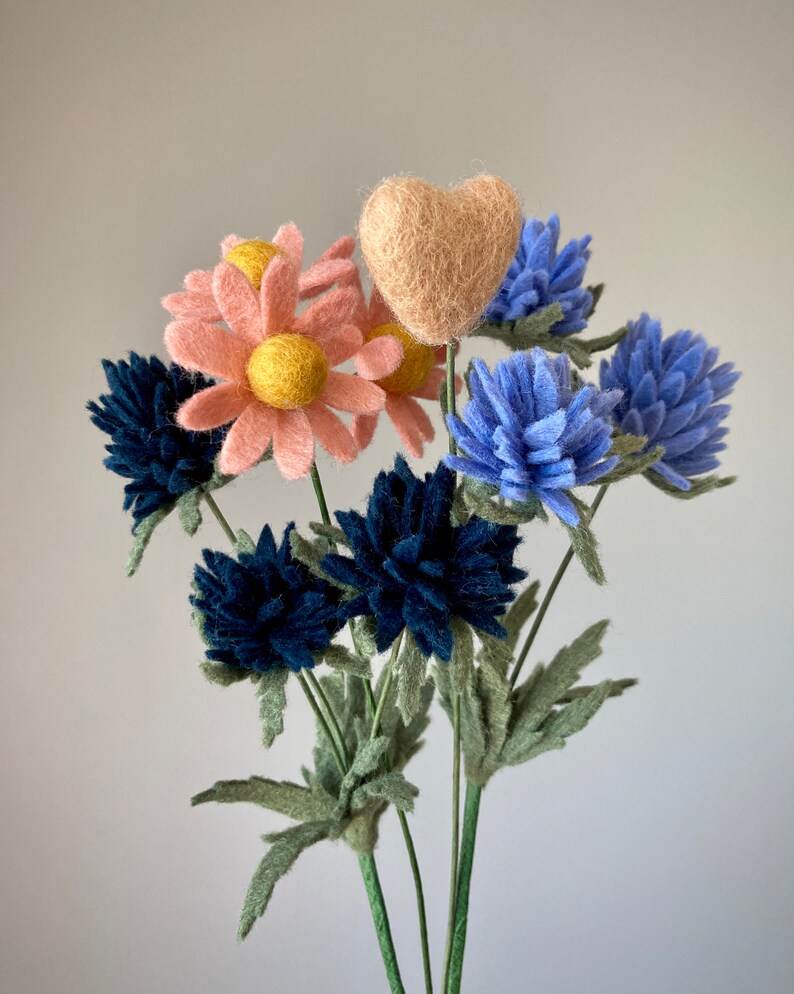 An example of a tiny cameo heart with other small felt flowers