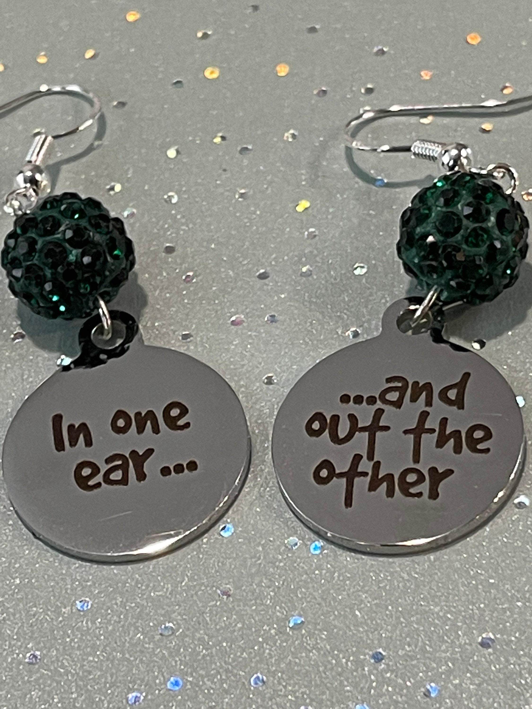 In one ear deals out the other earrings