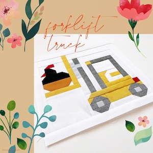 May include: A white fabric square with a yellow and gray patchwork design of a forklift truck. The text "forklift truck" is written in orange above the truck.