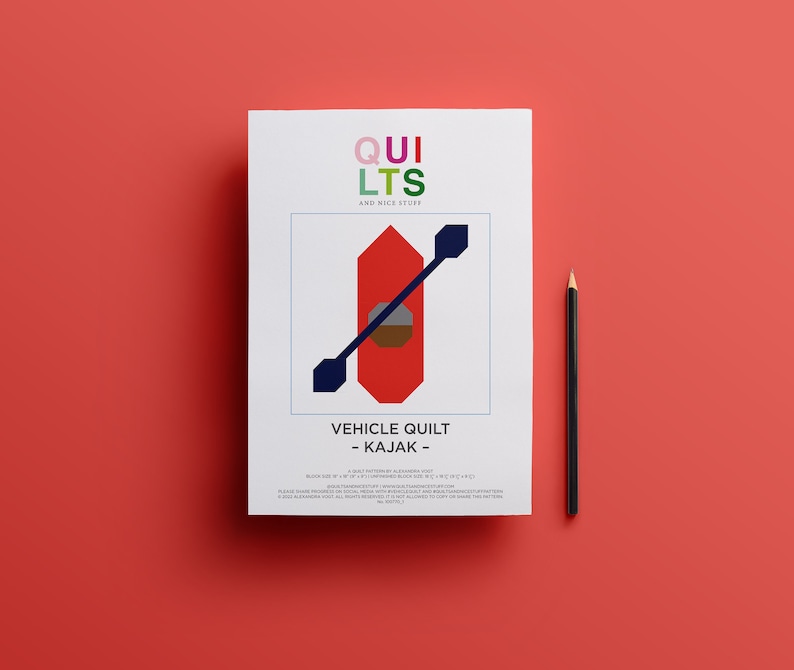 May include: A white paper with the text "QUILTS AND NICE STUFF" and a red kayak graphic. The text "VEHICLE QUILT - KAJAK -" is below the graphic. A black pencil rests on a red background.
