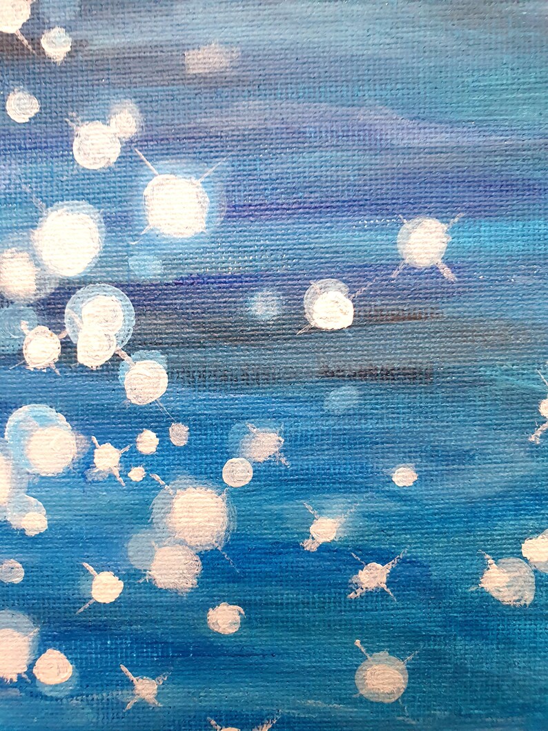 May include: Abstract painting with a textured canvas. The artwork features a gradient of blues, with white, circular, and star-like shapes scattered across the surface. The painting evokes a sense of depth and movement.