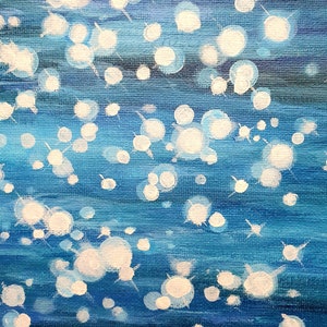 May include: Abstract painting with a blue and white color palette. The artwork features a textured canvas with horizontal brushstrokes in varying shades of blue. White, circular shapes with radiating lines are scattered across the surface.