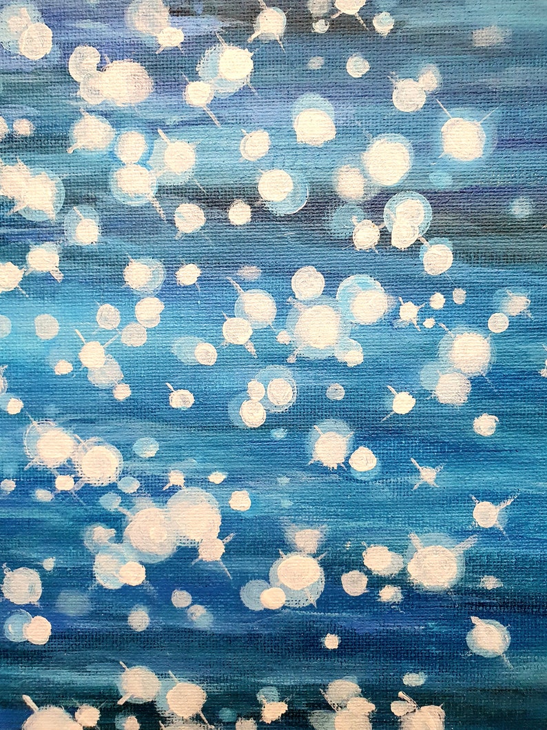 May include: Abstract painting with a blue and white color palette. The artwork features a textured canvas with horizontal brushstrokes in varying shades of blue. White, circular shapes with radiating lines are scattered across the surface.