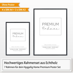 May include: A set of 7 black picture frames for displaying posters. The frames are made of real wood and come in two sizes: 21 x 29.7 cm and 29.7 x 42 cm. The frames are labeled "Premium Rahmen" and "Hyggelig Home - Poster Sets - The Danish art of happiness".