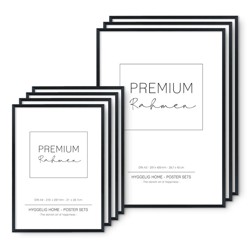 May include: A set of six black picture frames with white mats. The frames are stacked on top of each other. The largest frame is labeled "PREMIUM Rahmen" and has the dimensions 29.7 x 42 cm. The smaller frame is labeled "PREMIUM Rahmen" and has the dimensions 21 x 29.7 cm. The text "HYGGELIG HOME - POSTER SETS - The danish art of happiness -" is printed below the dimensions.