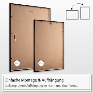 May include: Two black picture frames with brown backing. The larger frame is labeled "DIN A 3" and the smaller frame is labeled "DIN A 4". The frames have a simple hanging system for both portrait and landscape orientations.