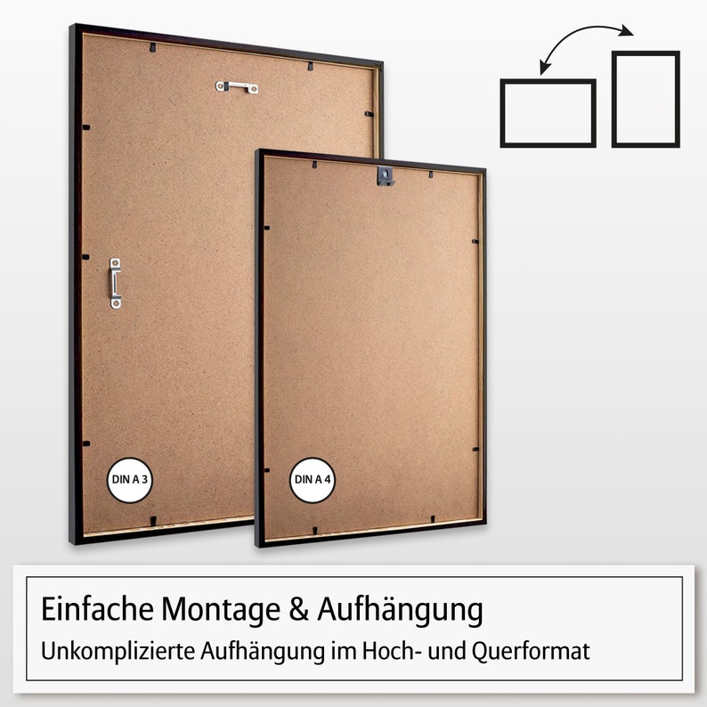 May include: Two black picture frames with brown backing. The larger frame is labeled "DIN A 3" and the smaller frame is labeled "DIN A 4". The frames have a simple hanging system for both portrait and landscape orientations.