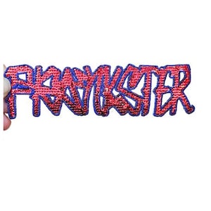 May include: A red and blue embroidered patch with the word "FRANKSTER" in a stylized font.