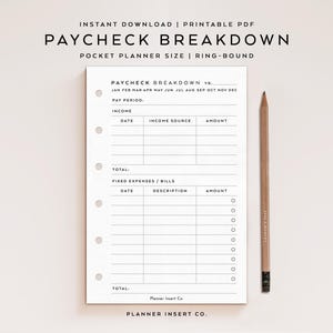 May include: A white Paycheck Breakdown pocket planner insert with a pencil. The planner includes sections for income, expenses, and totals. Text on the page includes "Paycheck Breakdown," "Income Source," and "Fixed Expenses/Bills." The pencil is light brown with black text.