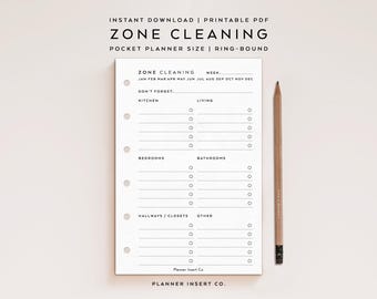 May include: A white printable planner page with the text "ZONE CLEANING" and a list of cleaning zones. A wooden pencil rests on the right side of the page. The planner is designed for pocket size and ring-bound use.