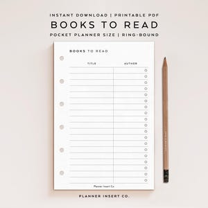 May include: A white printable planner insert with the text "BOOKS TO READ" and sections for title and author. A wooden pencil rests beside the planner. The planner is ring-bound and pocket-sized.