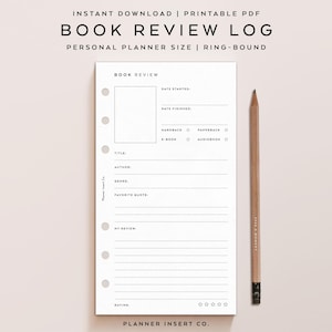 May include: A white book review log with a pencil on a light pink background. The log includes sections for title, author, genre, and a favorite quote. The text "BOOK REVIEW LOG" is at the top, with "PERSONAL PLANNER SIZE | RING-BOUND" below it.