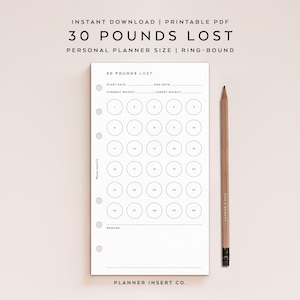 May include: A printable PDF planner insert with the text "30 POUNDS LOST". The white planner page has circles for tracking progress, with space for start and end dates, current and target weight. A wooden pencil rests on the side.