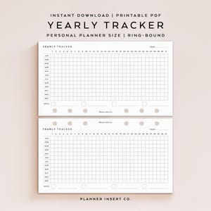 May include: Two white yearly tracker planner inserts with a grid layout for tracking daily activities. The top of the inserts have the text "YEARLY TRACKER" and "PERSONAL PLANNER SIZE | RING-BOUND". The inserts are designed for personal planners.