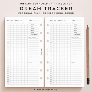 May include: A printable Dream Tracker personal planner in a ring-bound format. The pages are white with a grid layout for tracking dreams, with sections for dates, moods, and notes. A wooden pencil rests on the right side.