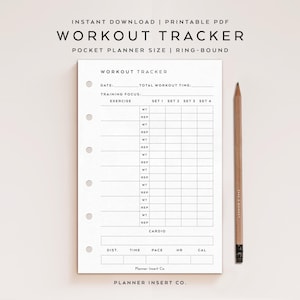 May include: A white workout tracker printable PDF with a ring-bound pocket planner size. The tracker includes sections for date, total workout time, training focus, exercise, and cardio. A wooden pencil rests on the right side of the page.