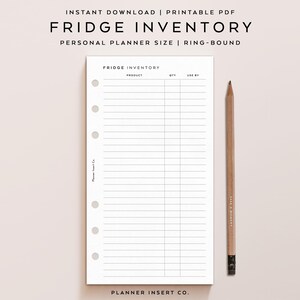 May include: A printable PDF fridge inventory planner insert with the text "FRIDGE INVENTORY" at the top. The planner has a lined layout with columns for product, quantity, and use-by dates. A wooden pencil rests on the right side.