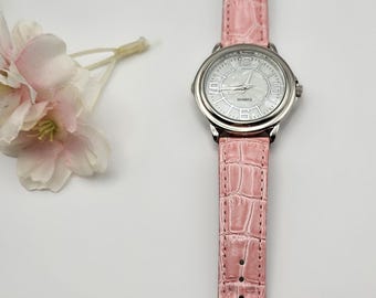 Pink leather Avon mother of pearl face watch. in box