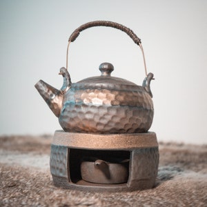 Traditional Japanese ceramic teapot with teapot warmer