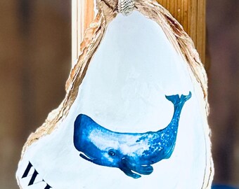 Una ballena caprichosa "bienvenida" en un gran colgador de ostras.