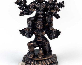Garuda carrying Lord Vishnu and Lakshmi Devi