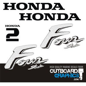 May include: A set of white and black Honda marine decals. The image features the Honda logo, the number 2, and the words "Four Stroke" in a decorative font. The text "High Quality Marine Decals From Outboard Graphics .com" is also visible.