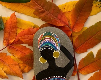 Painted African women rock,dotting mandala turban, rock art