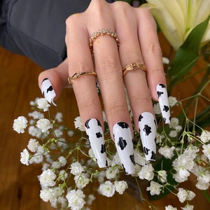 Cow print press on nails black and white nails image 2