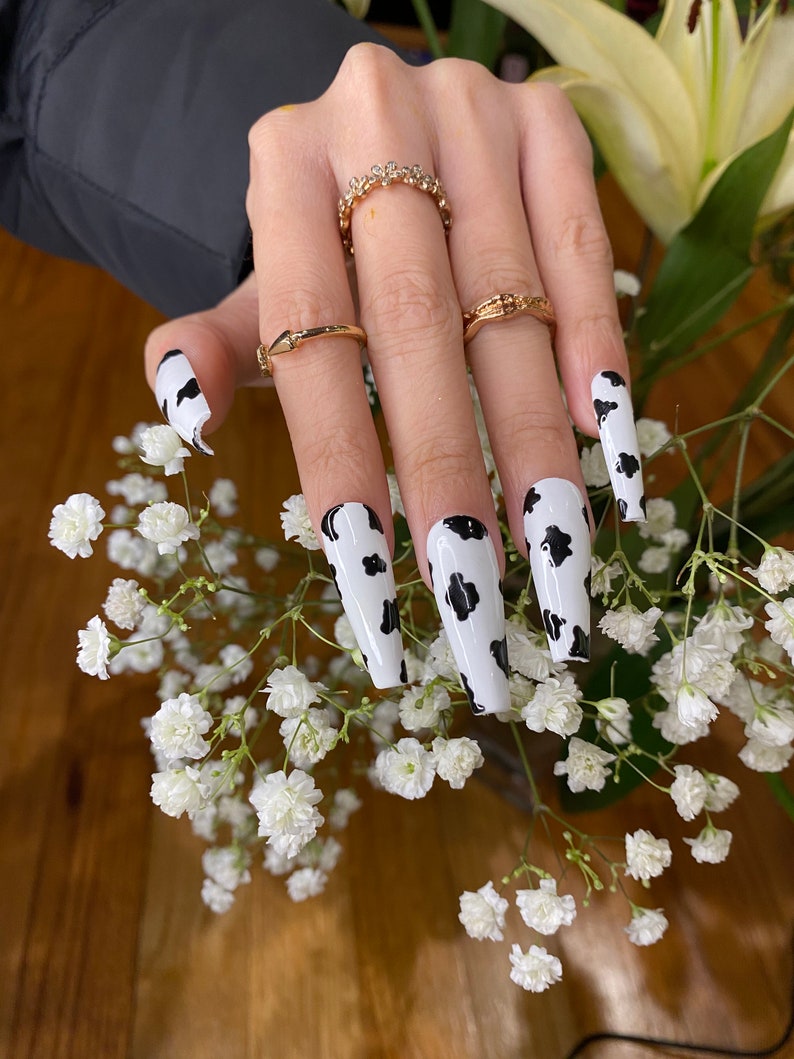 Cow print press on nails black and white nails image 2