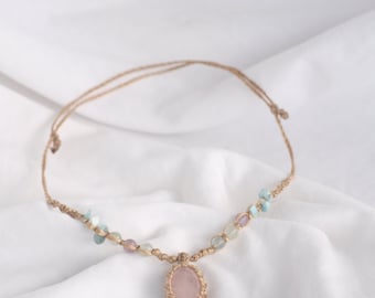 Rose quartz crystal macrame necklace.