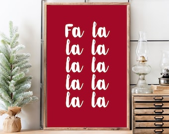 May include: A red printable wall art print with white text that says "Fa la la la la la la la".