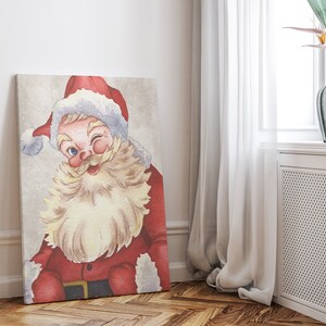 May include: A vintage-style illustration of Santa Claus with a white beard and red suit, winking and smiling. The background is a light beige color.