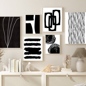 May include: A set of six black and white abstract art prints with geometric and organic shapes. The prints are framed and hung on a light beige wall.