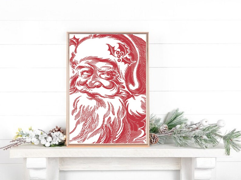 K&ouml;nnte beinhalten: Eine rote und wei&szlig;e Vintage-Illustration von Santa Claus' Gesicht in einem Holzrahmen. Die Illustration ist im Line-Art-Stil gehalten und zeigt eine detaillierte Darstellung von Santas Bart und Schnurrbart.