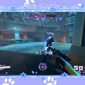 May include: A first-person view of a video game, showing a character holding a weapon with a neon purple and green design. The character is in a futuristic setting with a blue and purple colour scheme. The game's user interface is visible in the top left corner, showing the player's health, armour, and other stats. The game's name is "neon cat overlay" in the top centre of the image.