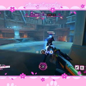 May include: A first-person view of a video game, showing a player holding a neon green and black weapon with a blue energy effect. The player's health bar is visible in the upper left corner, and the game's interface is displayed in the lower right corner. The game's name is "neon cat overlay".