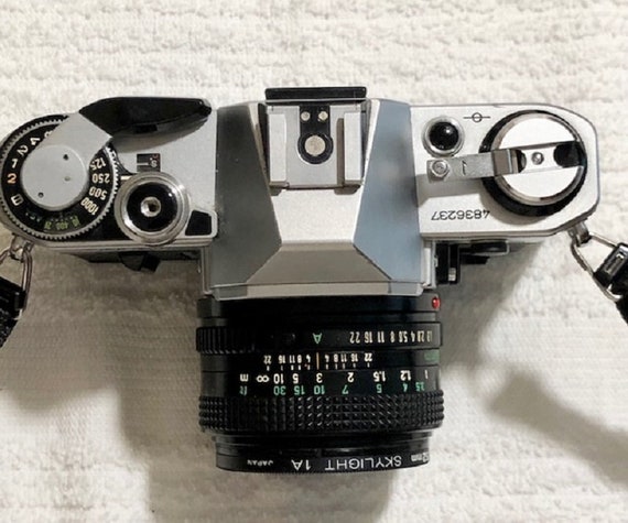Canon AE-1 Black + Lens FD 50mm F1.8 + Power Winder. Serial Number