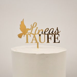 Peut inclure: Décor de gâteau doré avec une colombe et le texte "Lineas Taufe".
