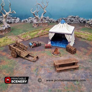May include: A miniature fantasy scene with a white tent, a wooden cart, a picnic table, and a campfire. There are also two treasure chests and a collection of barrels and crates. The scene is set on a grassy terrain with rocky formations and bare trees.