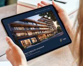May include: A tablet screen displaying a website for The Banks at Water Street, a modern apartment building with a dark blue background and gold accents. The text "those seeking the exceptional" is displayed on the screen.