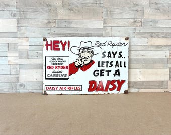 Vintage Red Ryder Daisy Porcelain Enamel Sign 12x8 Cowboy BB Gun Advertising Western Garage Man Cave Wall Decor