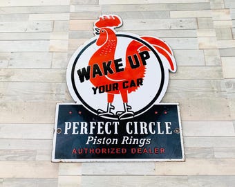 Stary porcelanowy znak „Kogut się budzi” Idealne koło Pierścienie tłokowe Olej napędowy 12" x 9"