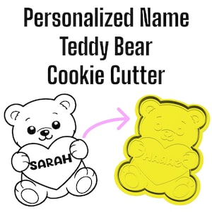 May include: A yellow teddy bear cookie cutter with a heart-shaped design. The heart has the name "SARAH" engraved on it. The image also shows a black and white illustration of the same design, along with the text "Personalized Name Teddy Bear Cookie Cutter."