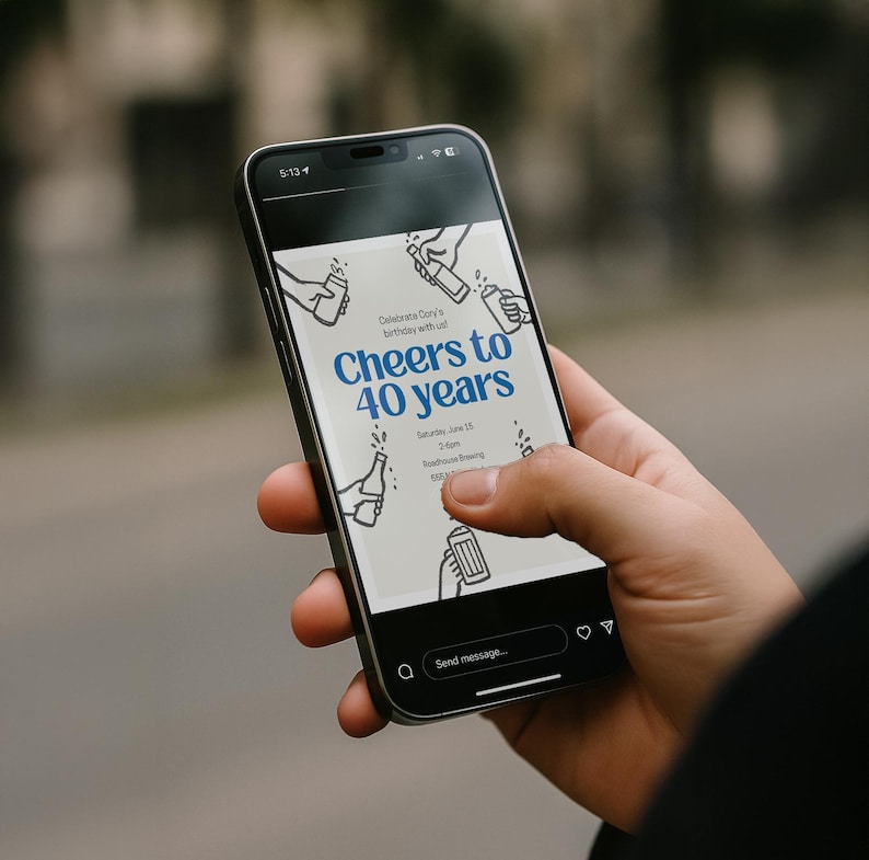May include: A black smartphone displays a birthday invitation with the text "Cheers to 40 years" in blue. The invitation features illustrations of hands holding bottles and beer mugs. The phone is held by a person.