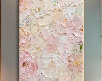 May include: A vertical rectangular wall art piece featuring a thick impasto oil painting of layered floral blooms in soft shades of blush pink, cream, and pale peach, enclosed within a thin, metallic gold frame that highlights the textured surface.