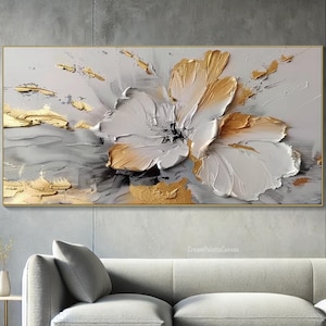 May include: Abstract painting of a white flower with gold accents on a gray background. The flower is painted in a textured style, giving it a three-dimensional appearance.
