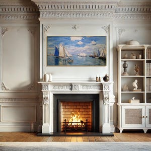 May include: A living room with a white fireplace, a painting of sailboats on the water, and a bookshelf. The fireplace has a lit fire. The walls are white with decorative molding. The floor is wood.