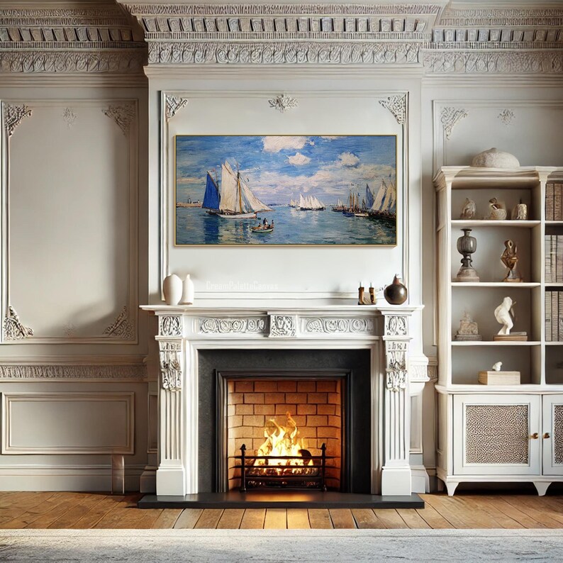 May include: A living room with a white fireplace, a painting of sailboats on the water, and a bookshelf. The fireplace has a lit fire. The walls are white with decorative molding. The floor is wood.